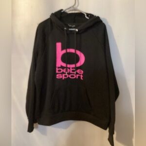 BEBE Sport NWOT 3X hooded sweater with two pockets in front. P2P 27” Length 28”